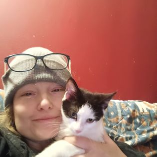 Elizabeth holding a cat