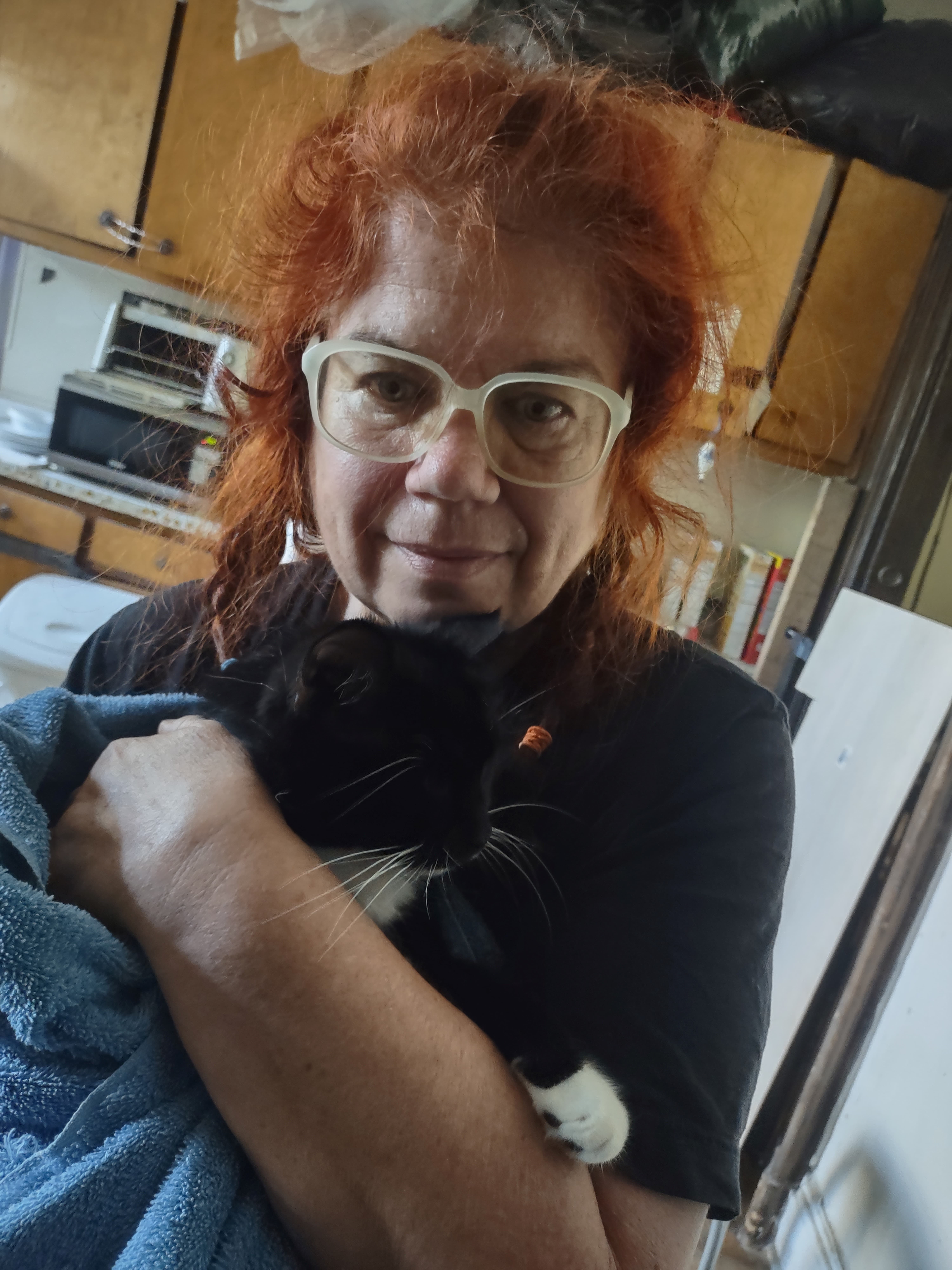 Linda Velwest Holding Her Cat, Cap'm Nick Furry