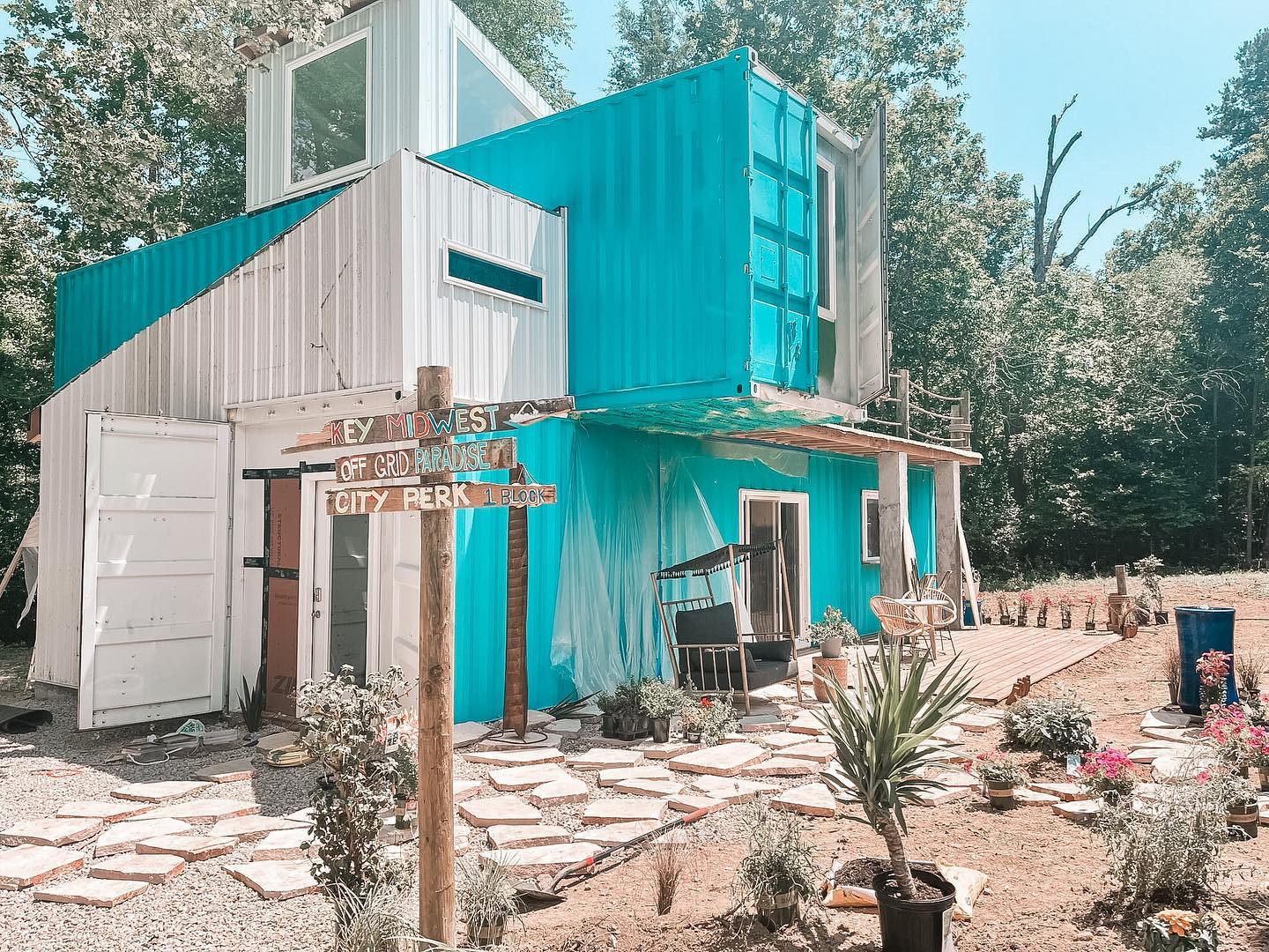 The BnB Where Donkey Rescuers can Stay on Stephanie's Property. It's bright blue and white with a tropical feel and it is made of shipping containers