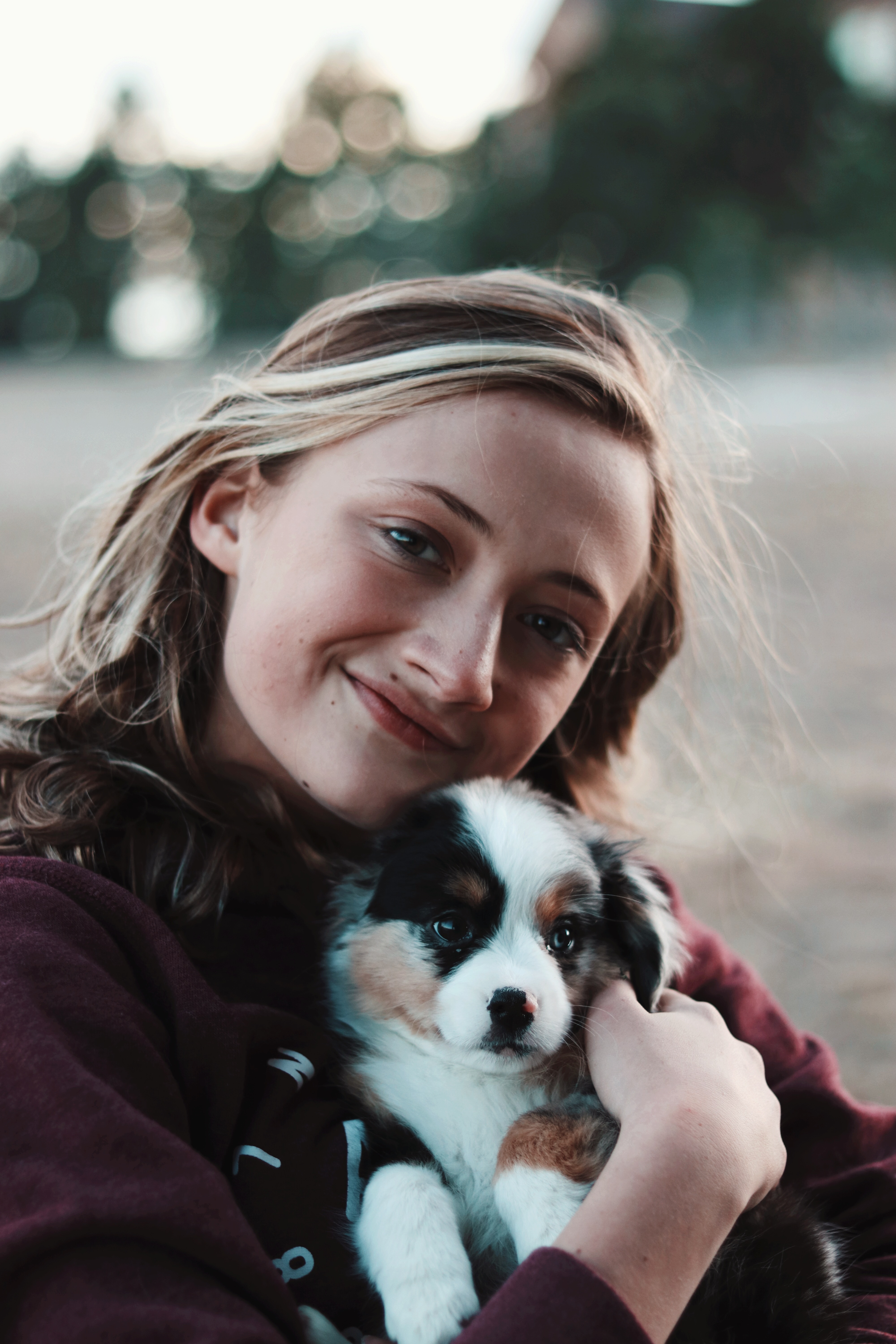 Happy Girl Cuddling a Rescued Shelter Dog and Showing Why Having a Pet Brings Joy Happy Girl Cuddling a Rescued Shelter Dog and Showing Why Having a Pet Brings Joy