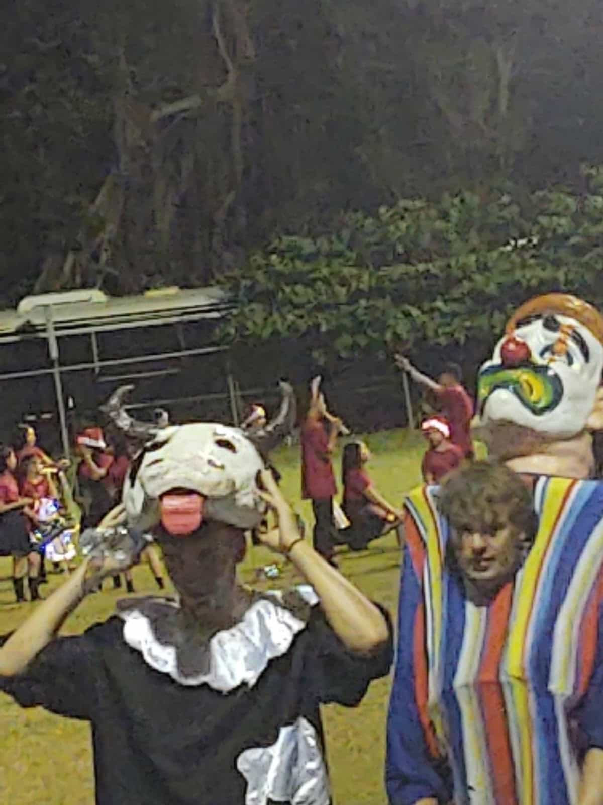 Two Guys on a Football Field. One Dressed Up Like a Cow and Another Like Some Sort of Character. There are Other People Dressed Normally in the Background in Esterillos Oeste