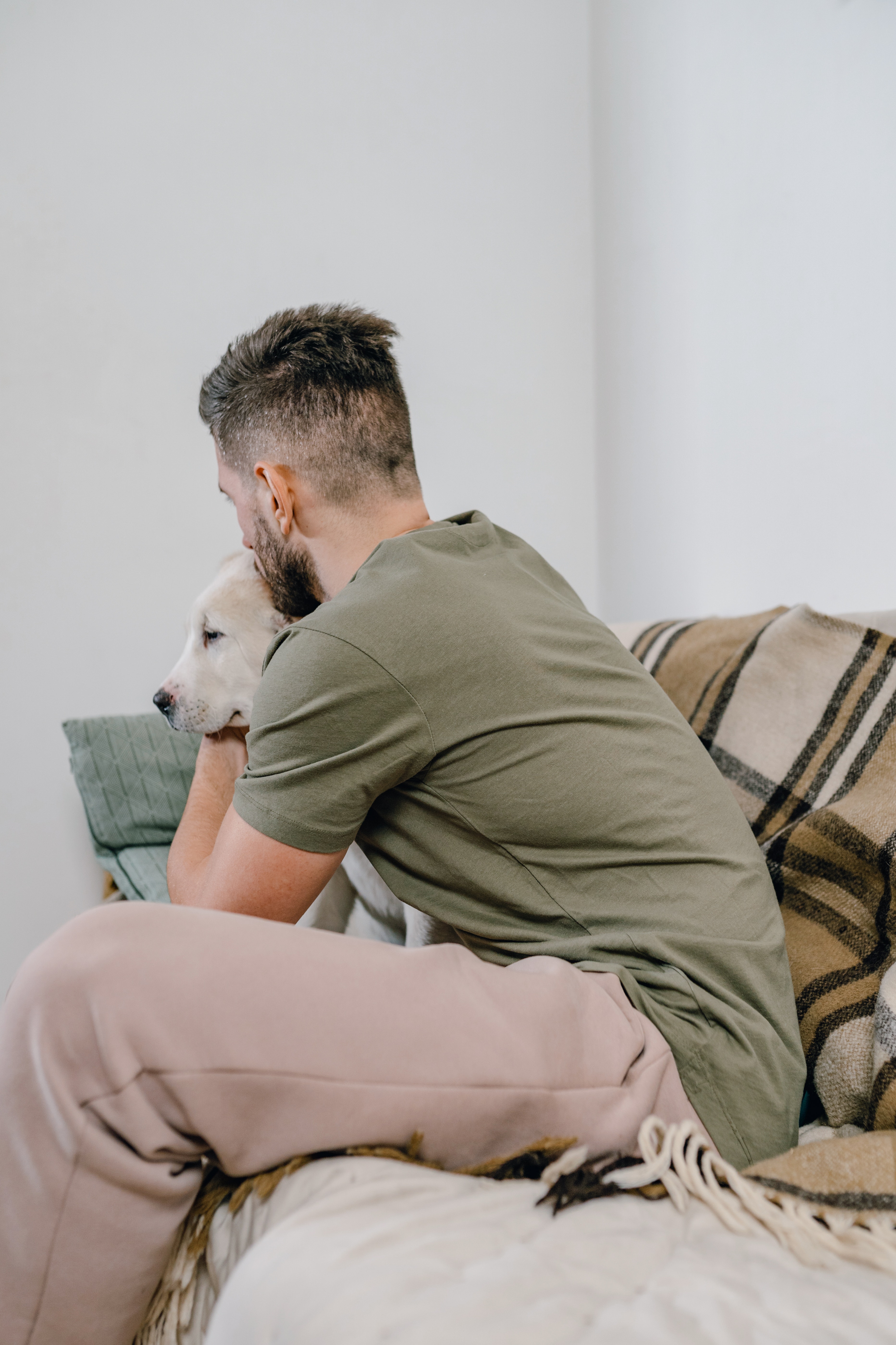 Man Hugging a Dog