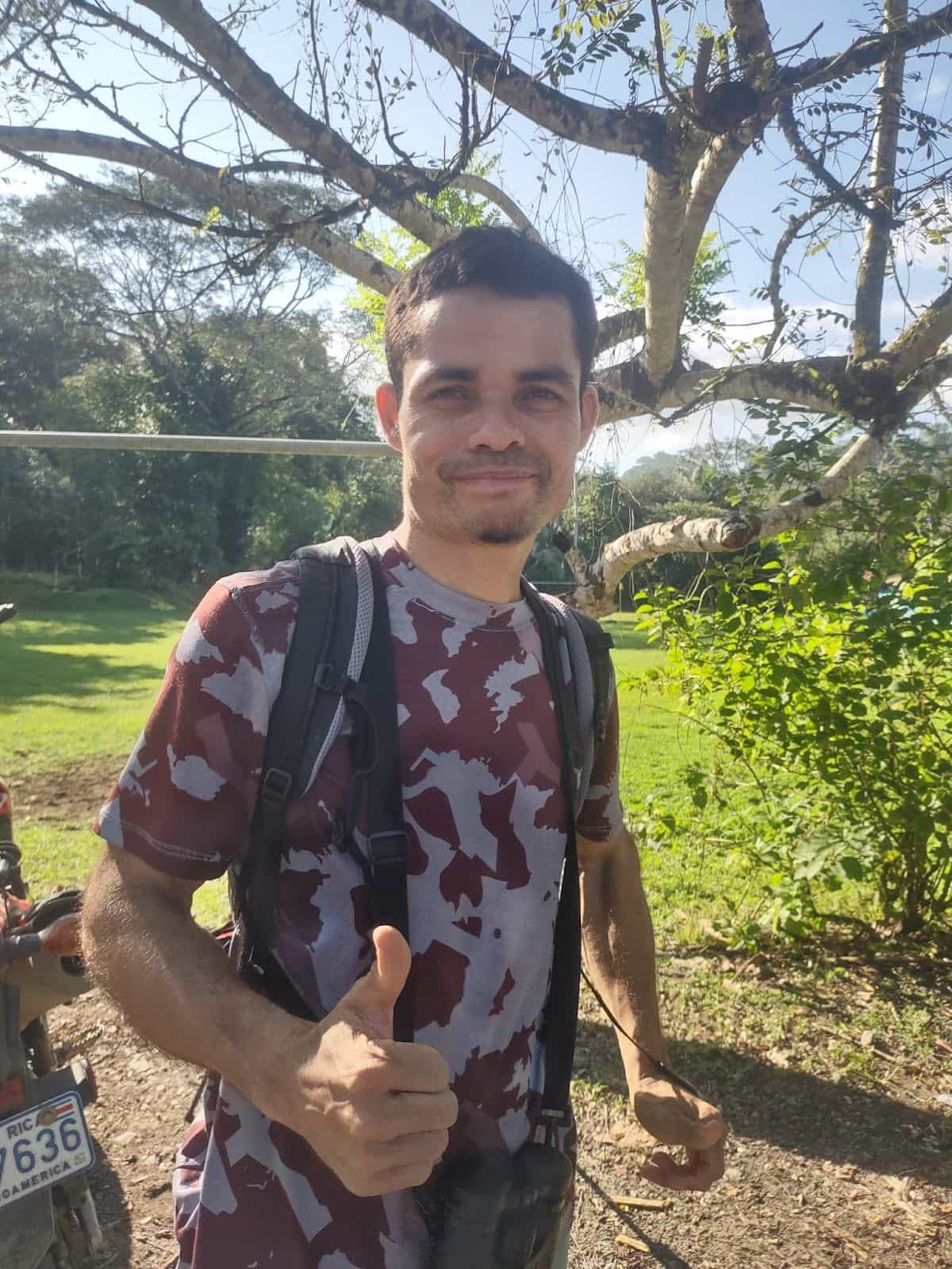 Rolando Standing Outside With a Pack Giving Us a Thumbs Up