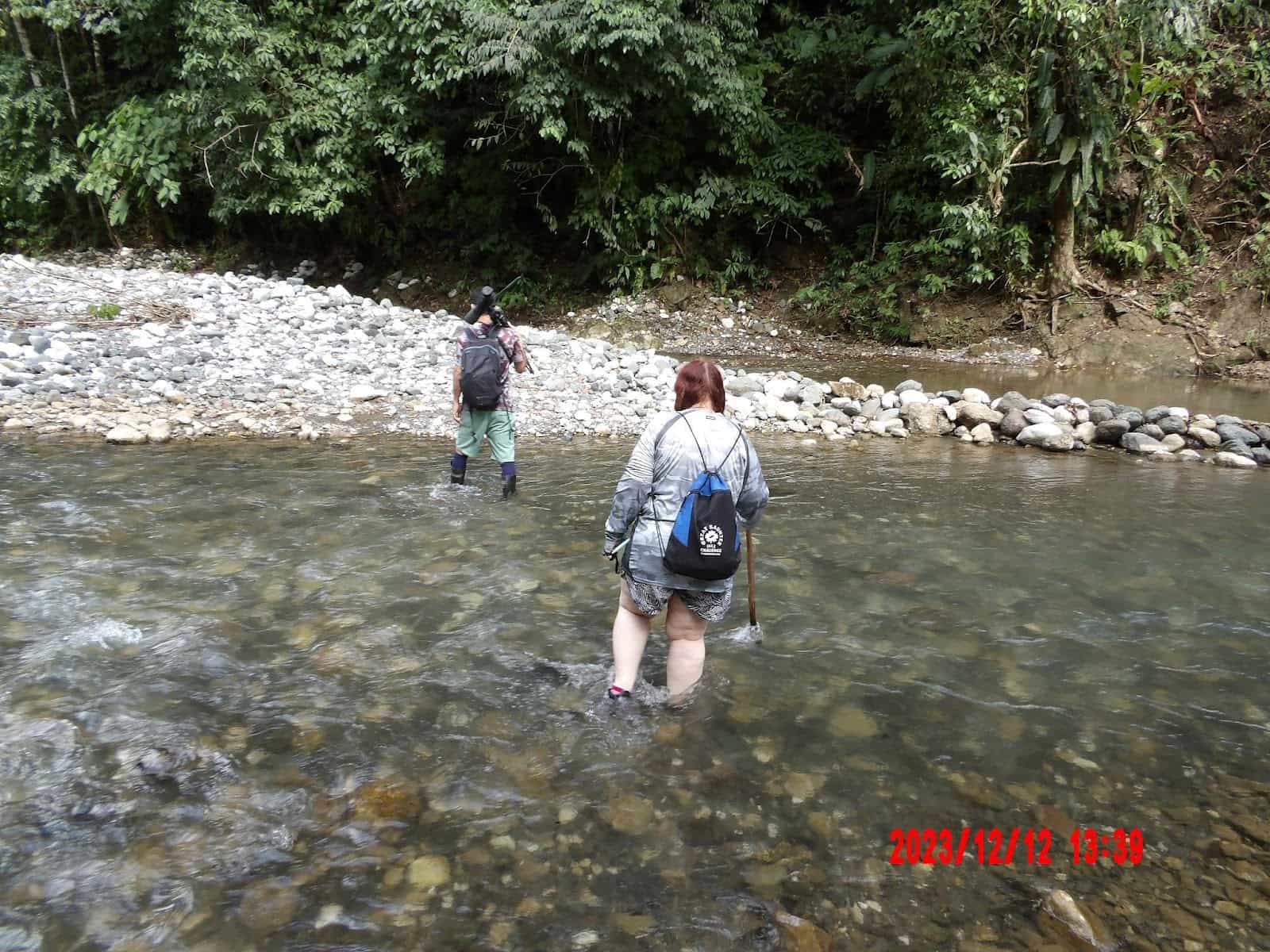 Me and Rolando Walking Through a River