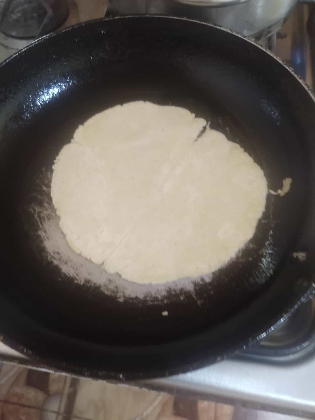 A Tortilla Frying in a Pan