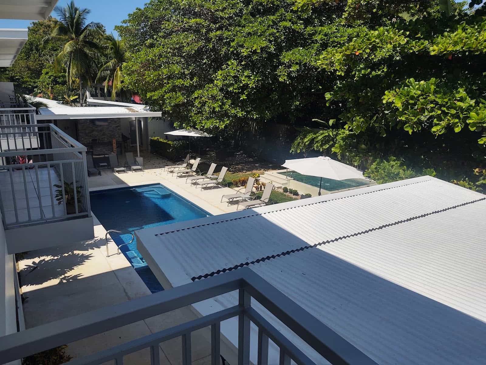 View of the Courtyard of Our Hotel Uvita Paradise With Two Pools and Lots of Trees in the Background View of the Courtyard of Our Hotel Uvita Paradise With Two Pools and Lots of Trees in the Background
