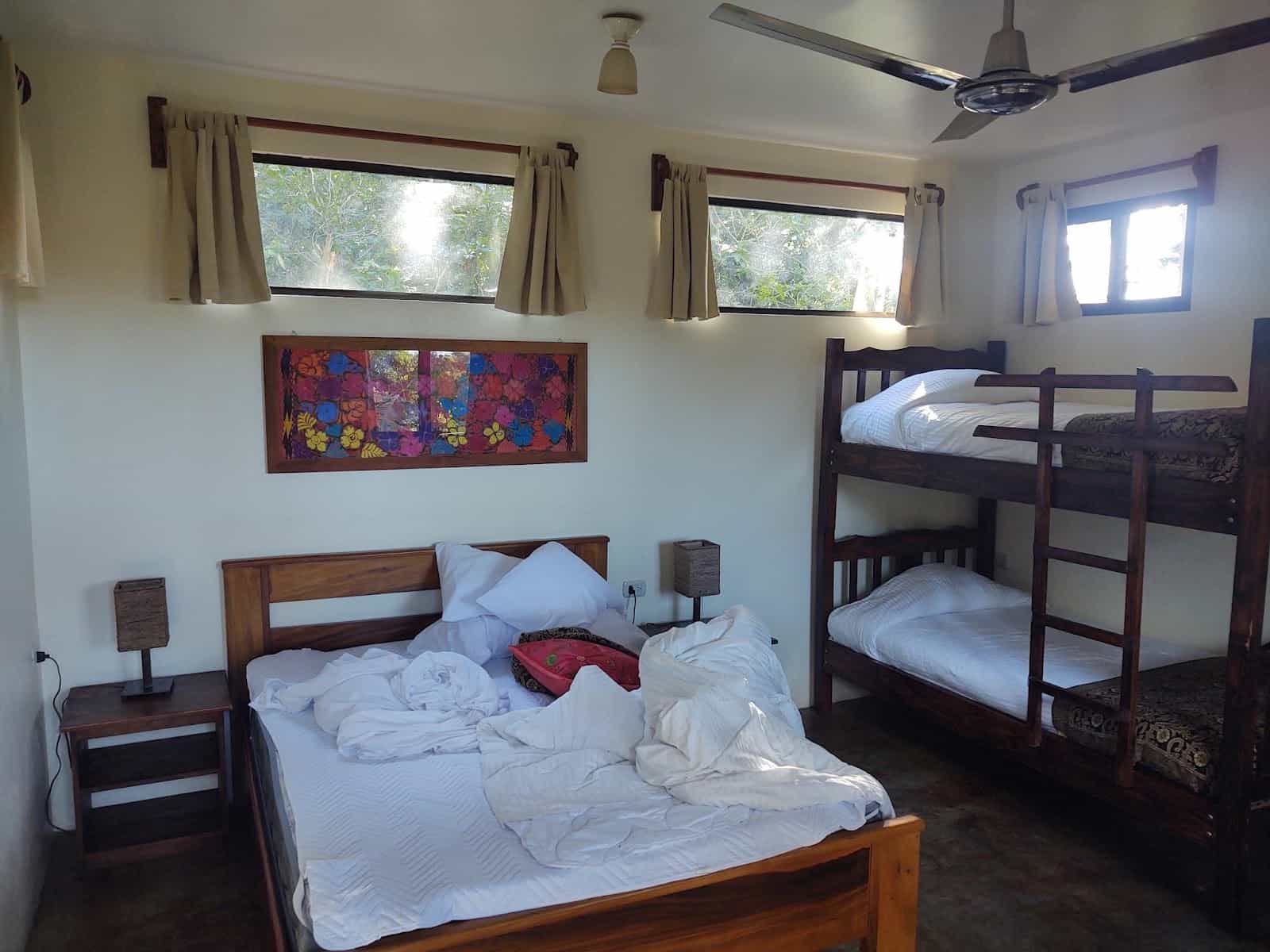 Our Room at Valle Escondido. There’s a Double Bed, Bunk Beds, and Lots of Windows at the Top of the Room