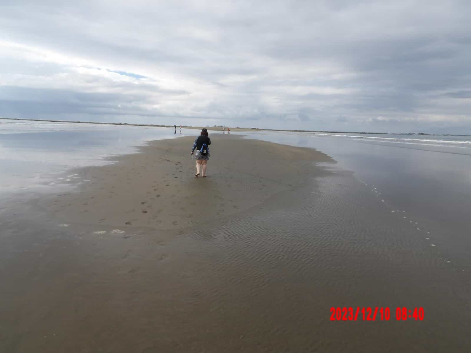 Walking on the Beach to the Whale’s Tail While the Tide Is Coming On From Both Sides Walking on the Beach to the Whale’s Tail While the Tide Is Coming On From Both Sides